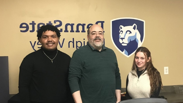 PSU-LV students Gianna Gomes and Fernando Gaton Bido with Dr. Anibal Torres