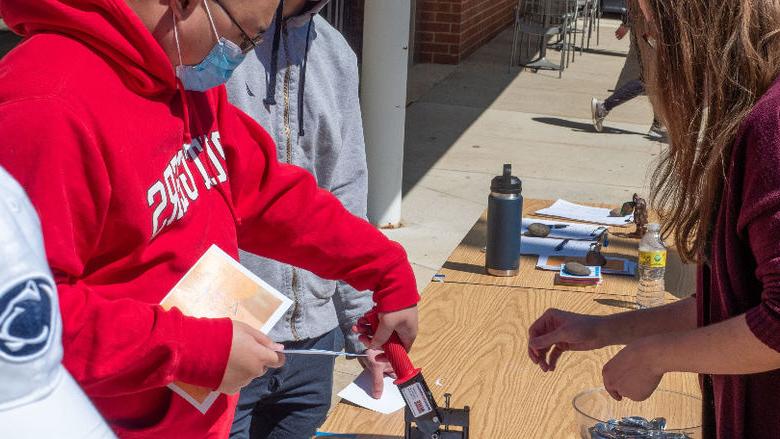 Students make buttons at Arts Fest 