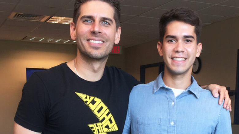 Carlos Andres Gomez, right, with student Juan Martinez in 2018