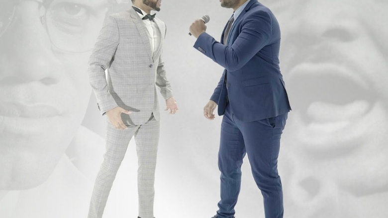 Image of two men engaging in a rap battle