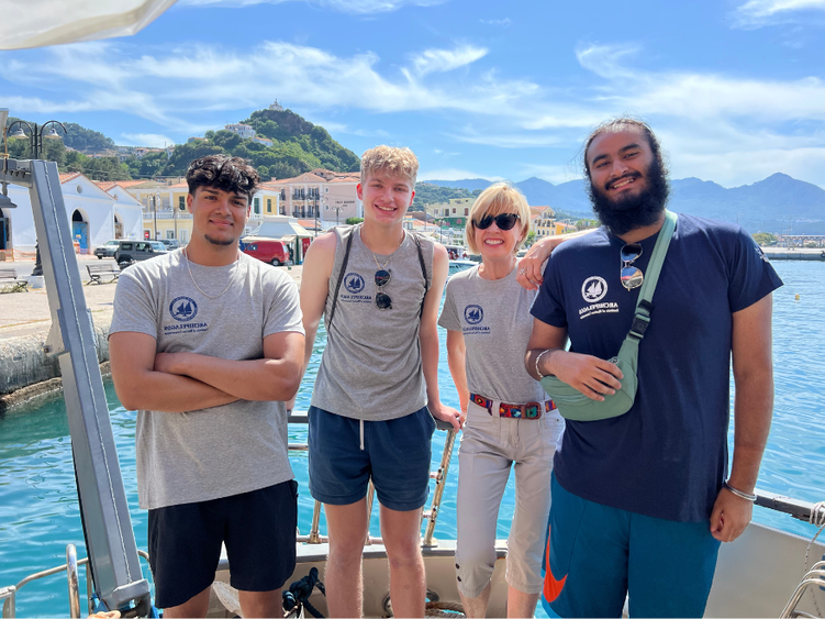 students smile in front of the Agean Sea in Greece 